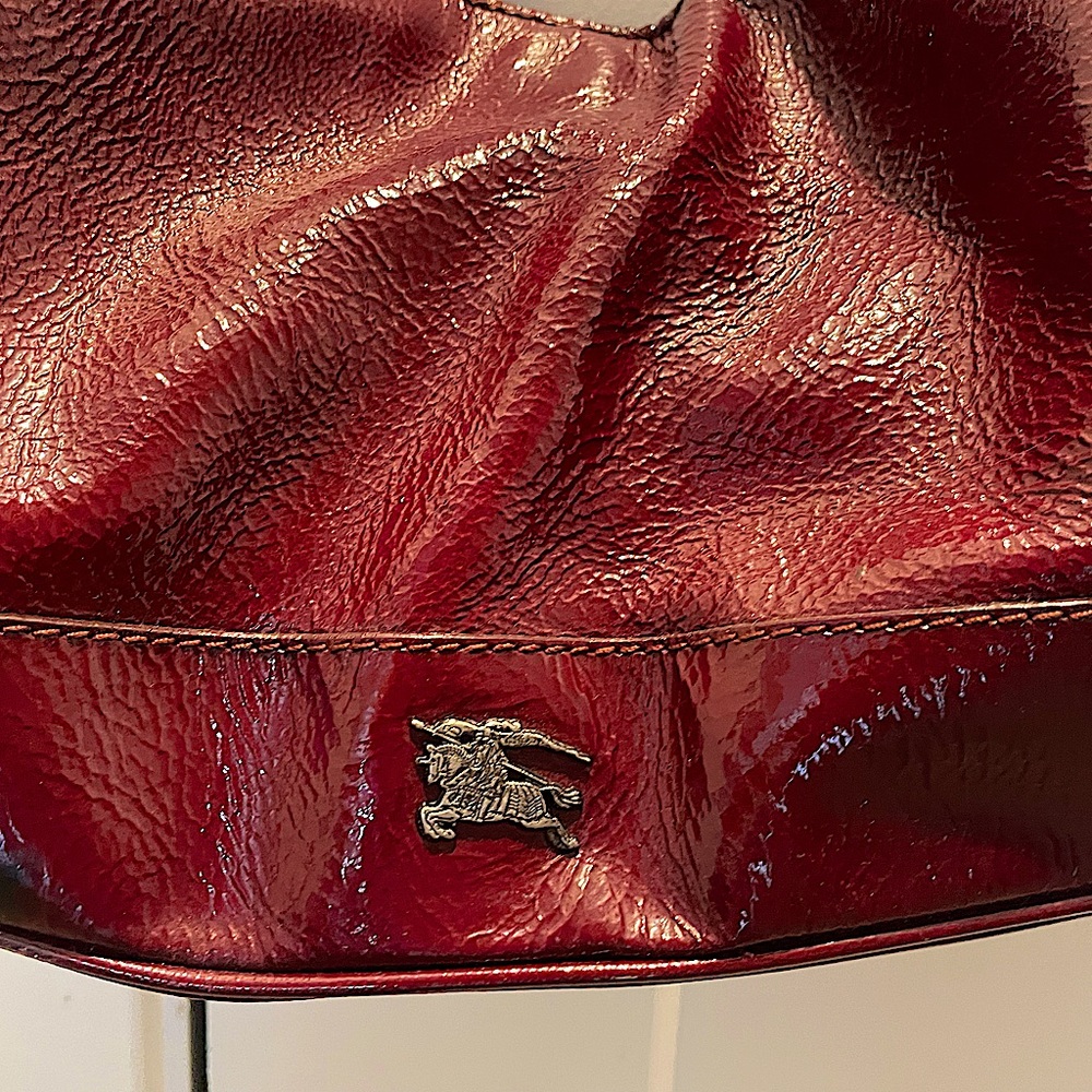 Burberry red patent leather bag.